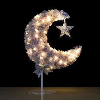 Het verschil tussen Crescent Tree-decoratie en echte plantendecoratie